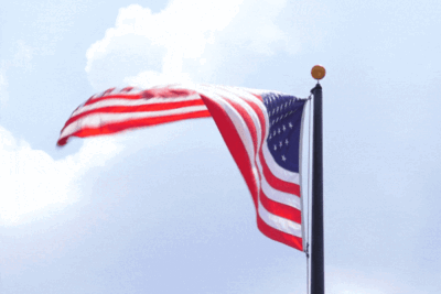 Image of flying American Flag - Flag Day in the Desert